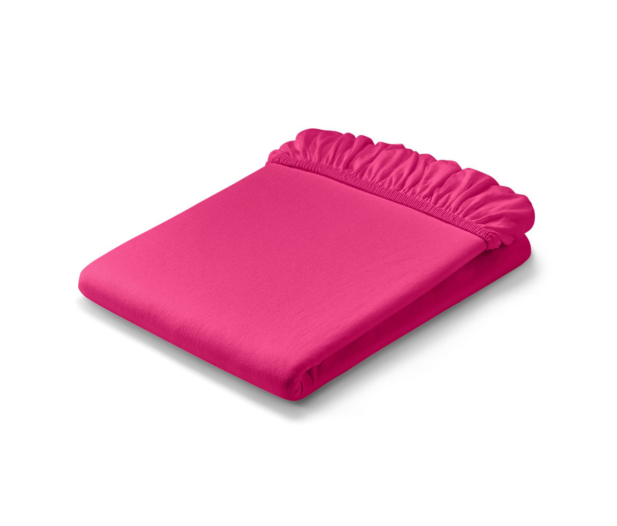 Drap-housse en jersey rose vif, taille normale et drap-housse en jersey, taille double, pliés.