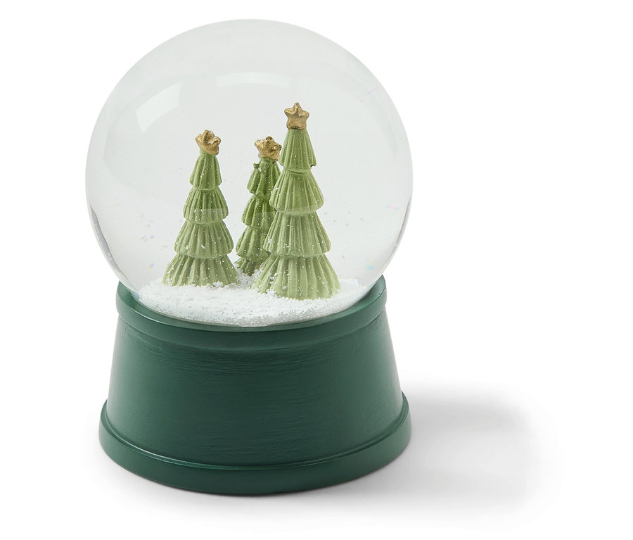 Boule à neige avec trois arbres verts à l'intérieur.