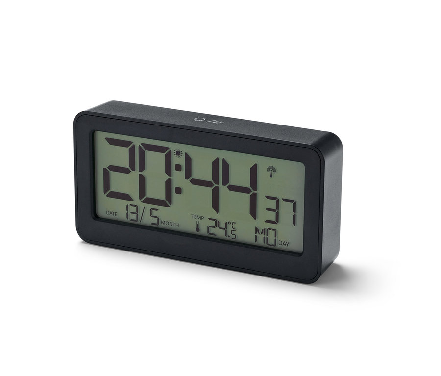 Un réveil radio numérique à écran LCD noir affiche l'heure 20:44.