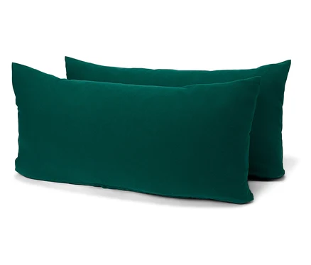 Deux coussins rectangulaires vert émeraude sur fond blanc.