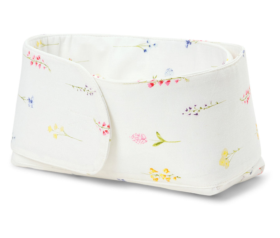 Une boîte de rangement blanche avec un motif floral.