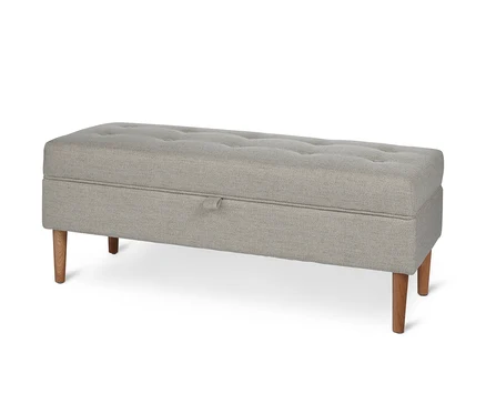 Banc rembourré gris avec espace de rangement et boutons.