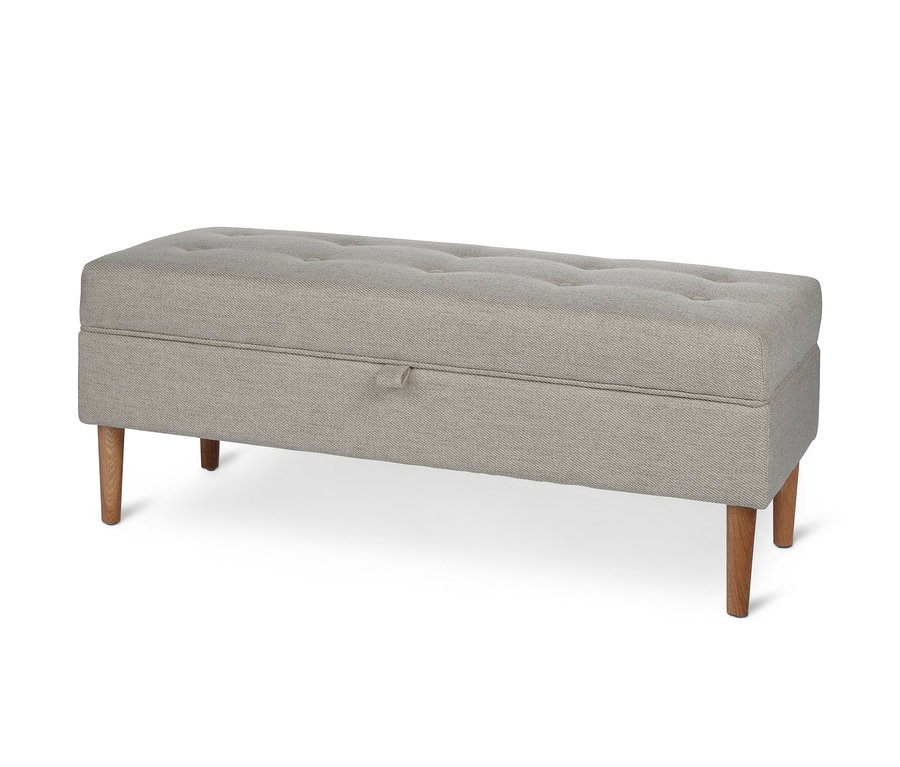 Banc rembourré gris avec espace de rangement et boutons.
