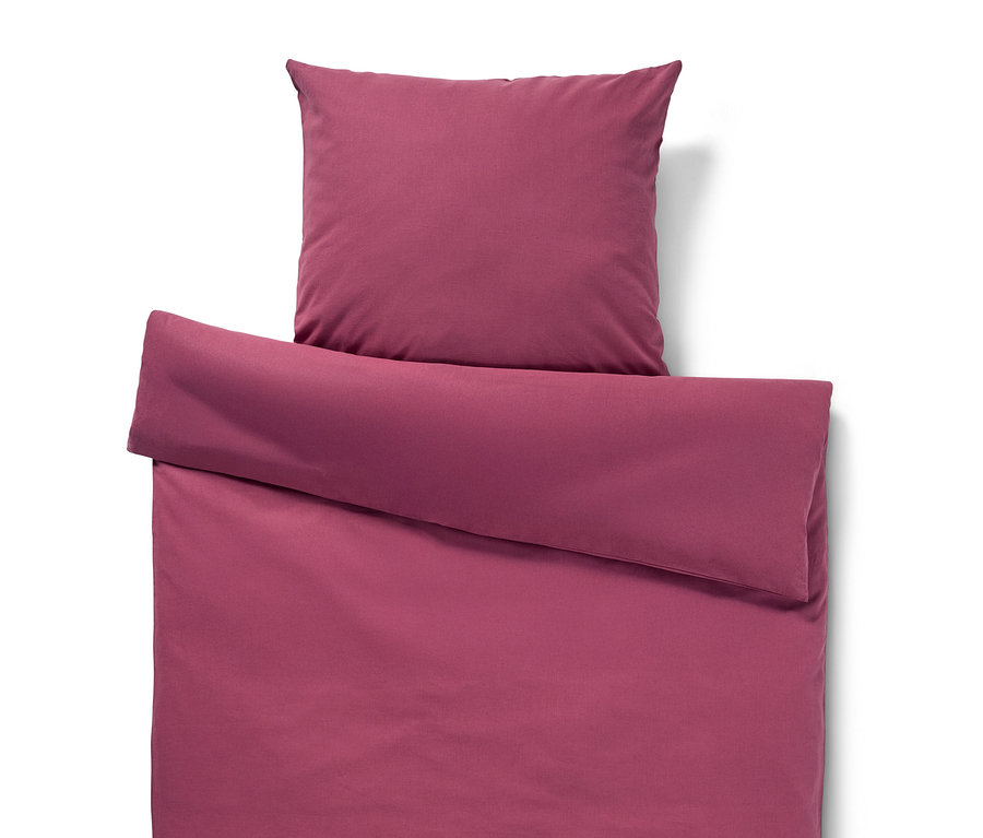 Parure de lit prune en métis, comprenant une taie d'oreiller.