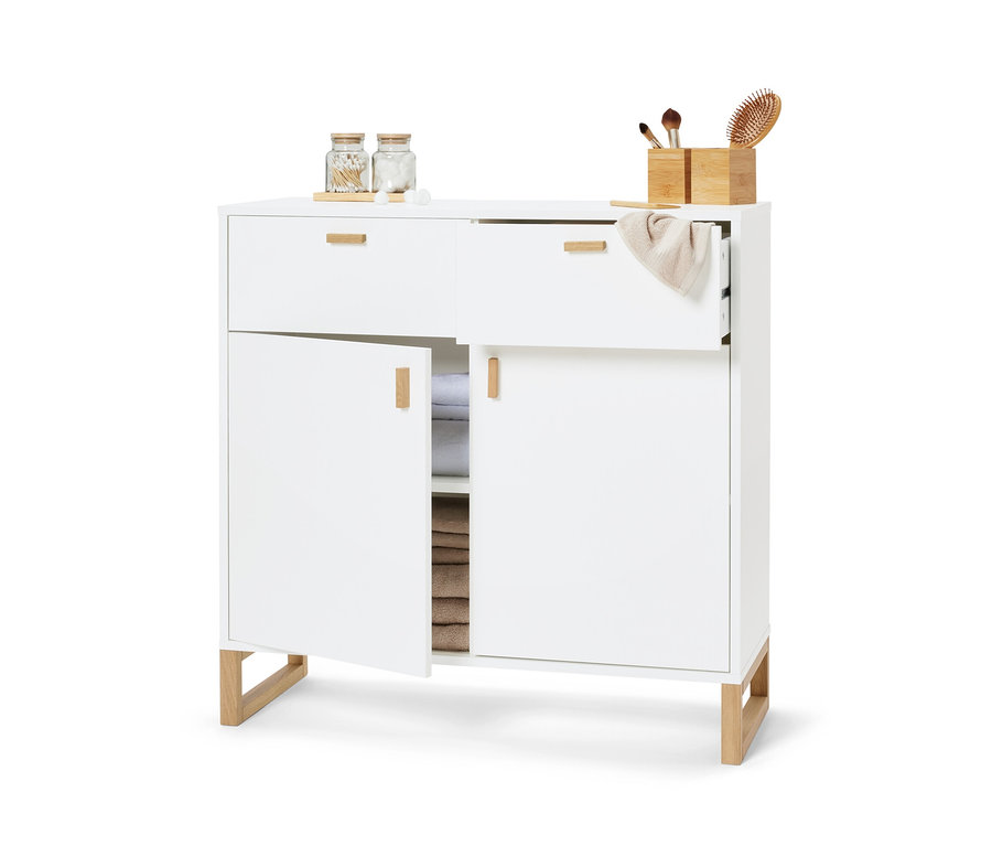 Buffet blanc avec 2 tiroirs et 2 portes, une porte est ouverte.