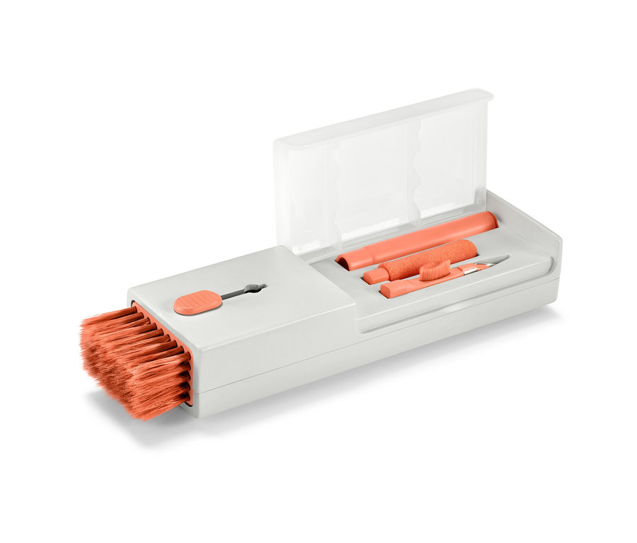 Un set de nettoyage de bureau 4 en 1 avec des poils et des accessoires orange.