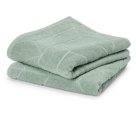 Pile de deux serviettes vert menthe avec motif géométrique.