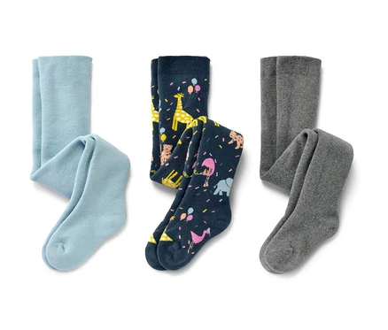 L'image montre trois collants thermiques pour enfant : une paire bleu clair, une paire bleu marine avec des motifs d'animaux et une paire grise.