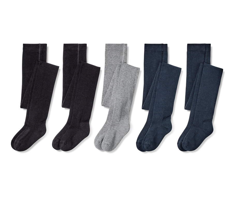 Cinq paires de collants pour enfant en noir, gris foncé, gris et bleu foncé.