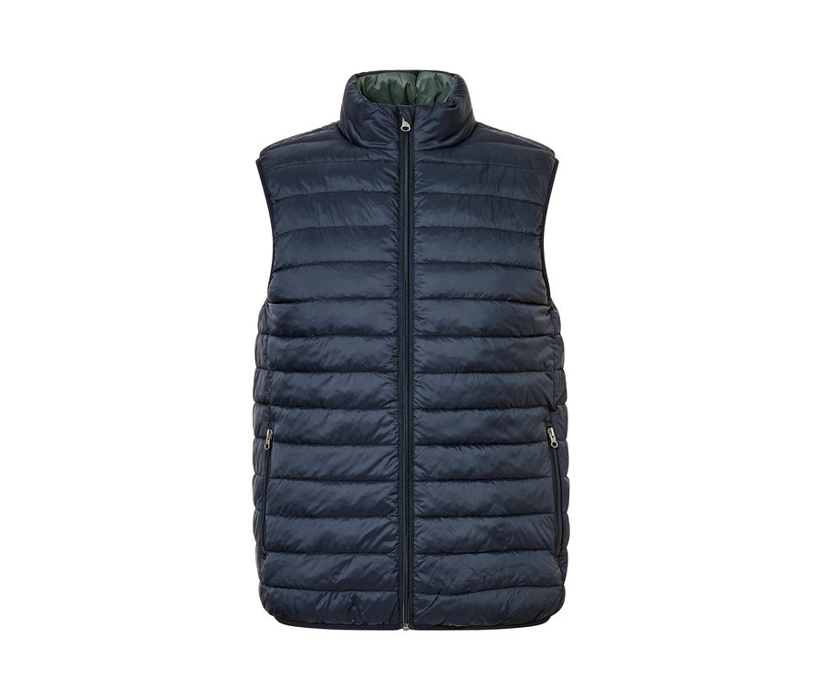 Un gilet réversible bleu marine avec une fermeture éclair au milieu.