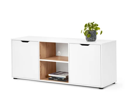 Buffet blanc avec tiroirs et plante en pot.