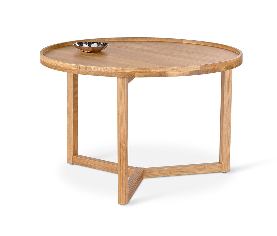 Table basse ronde en bois avec un bol dessus.