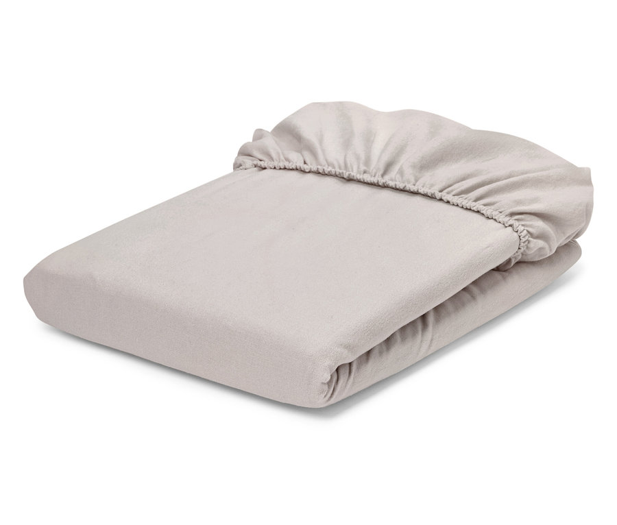 Drap-housse beige plié.