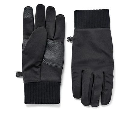 Deux gants noirs en softshell sont posés l'un à côté de l'autre.