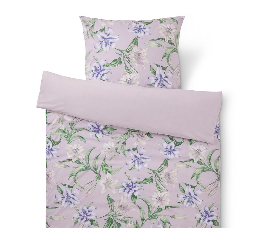Linge de lit lilas à motif de lys composé d'une taie d'oreiller et d'une housse de couette.