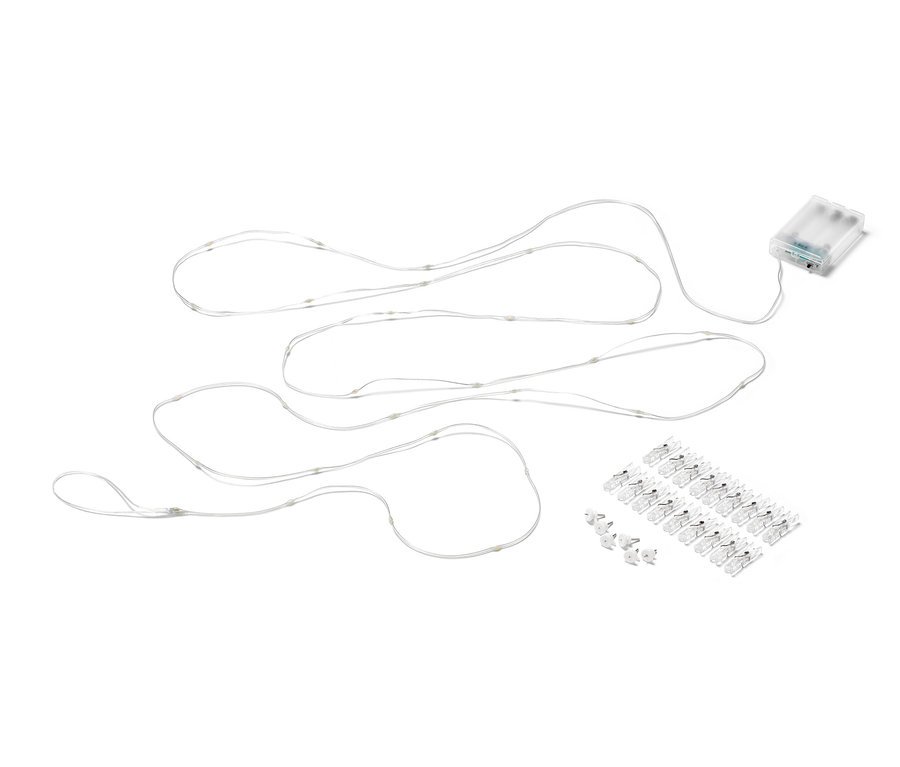 Guirlande lumineuse à LED avec pinces sur fond blanc.
