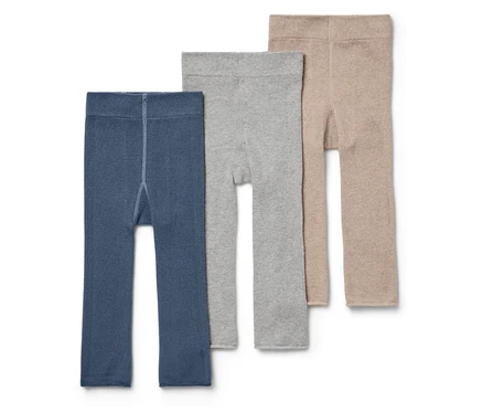 Trois leggings pour enfants en bleu, gris et beige côte à côte.