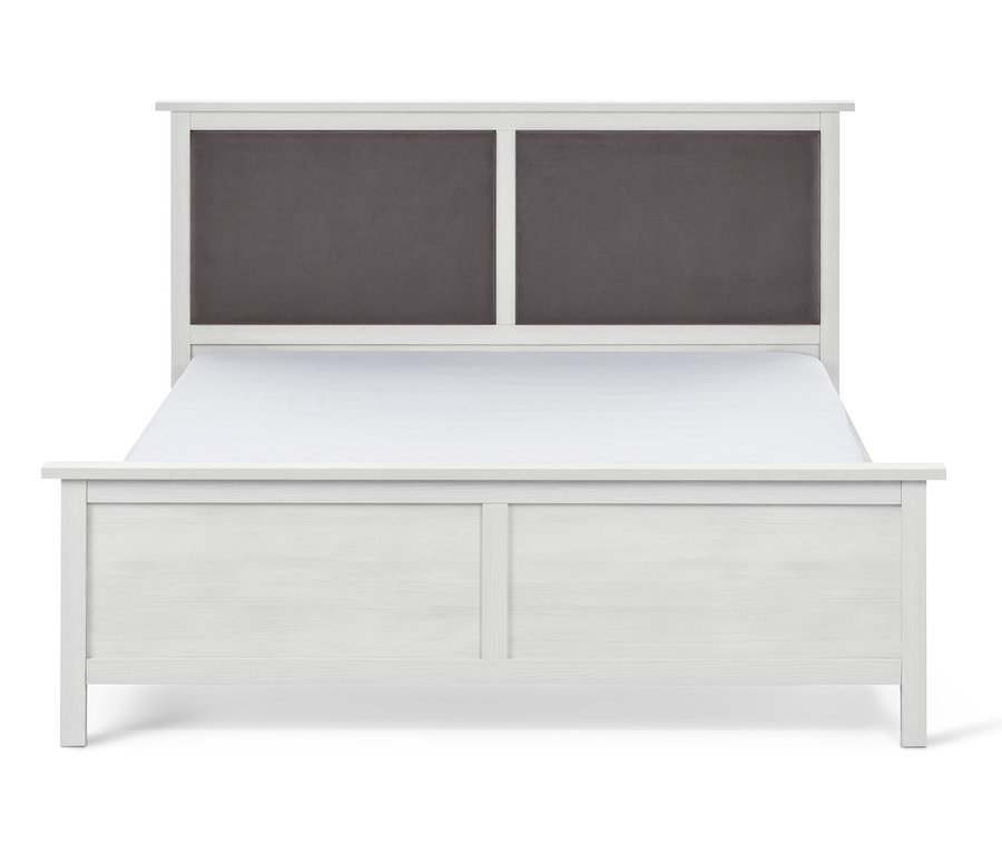 Lit blanc avec tête de lit rembourrée, env. 180 x 200 cm.