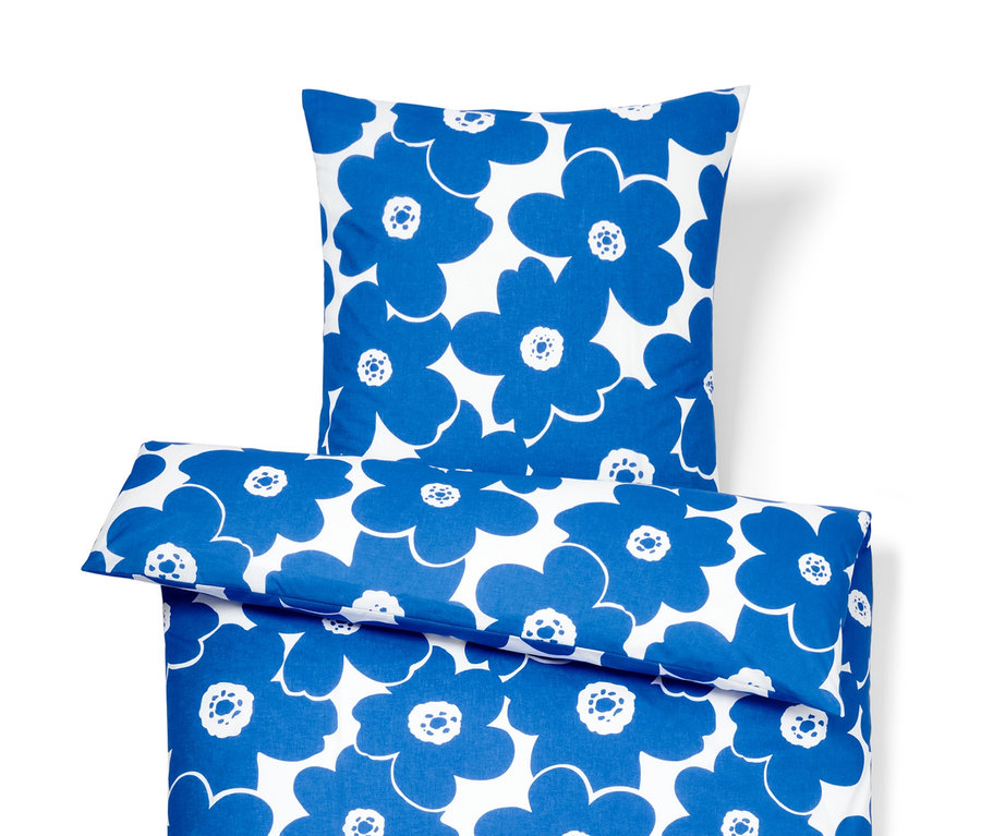 Parure de lit bleue en coton premium avec motif floral.