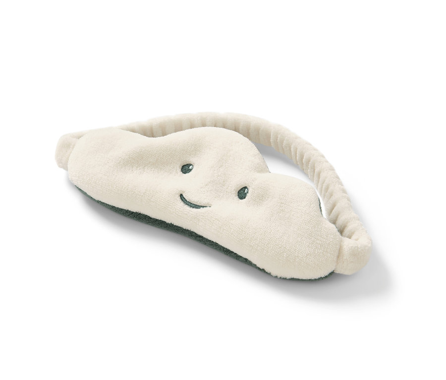 Un masque de nuit est sur un fond blanc.