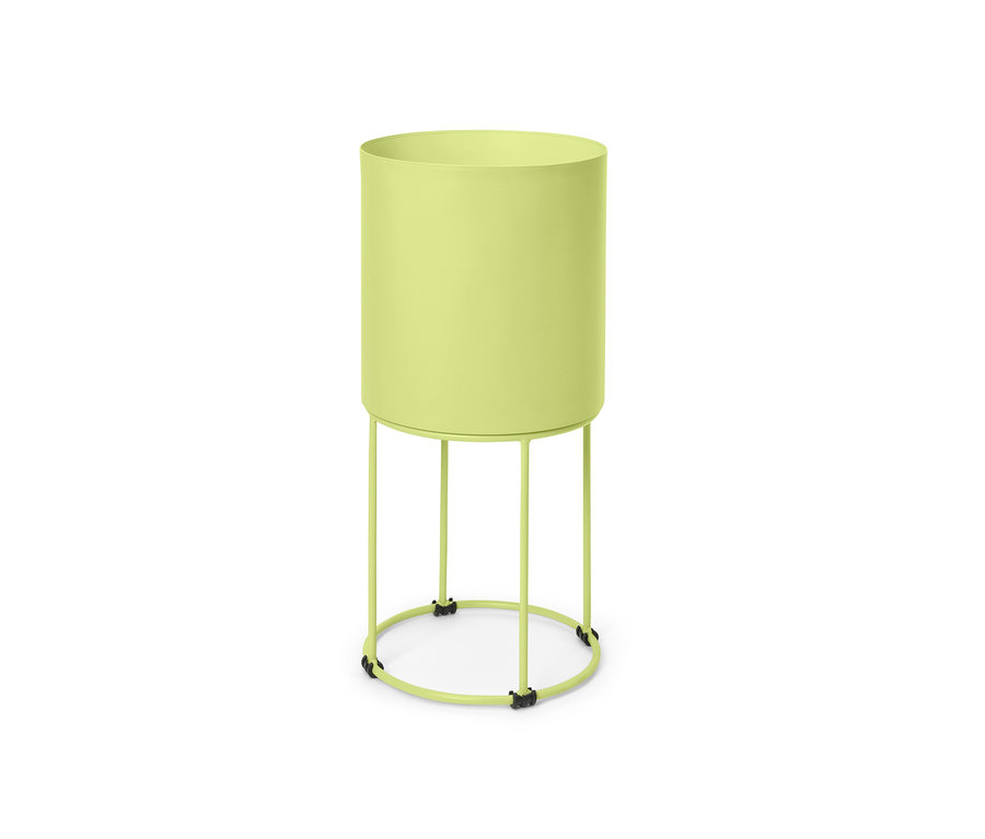 Cache-pot rond vert sur un support.