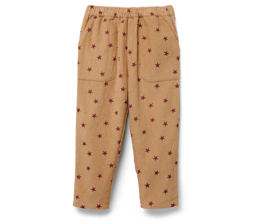 Pantalon en velours côtelé beige avec taille élastique et étoiles rouges.