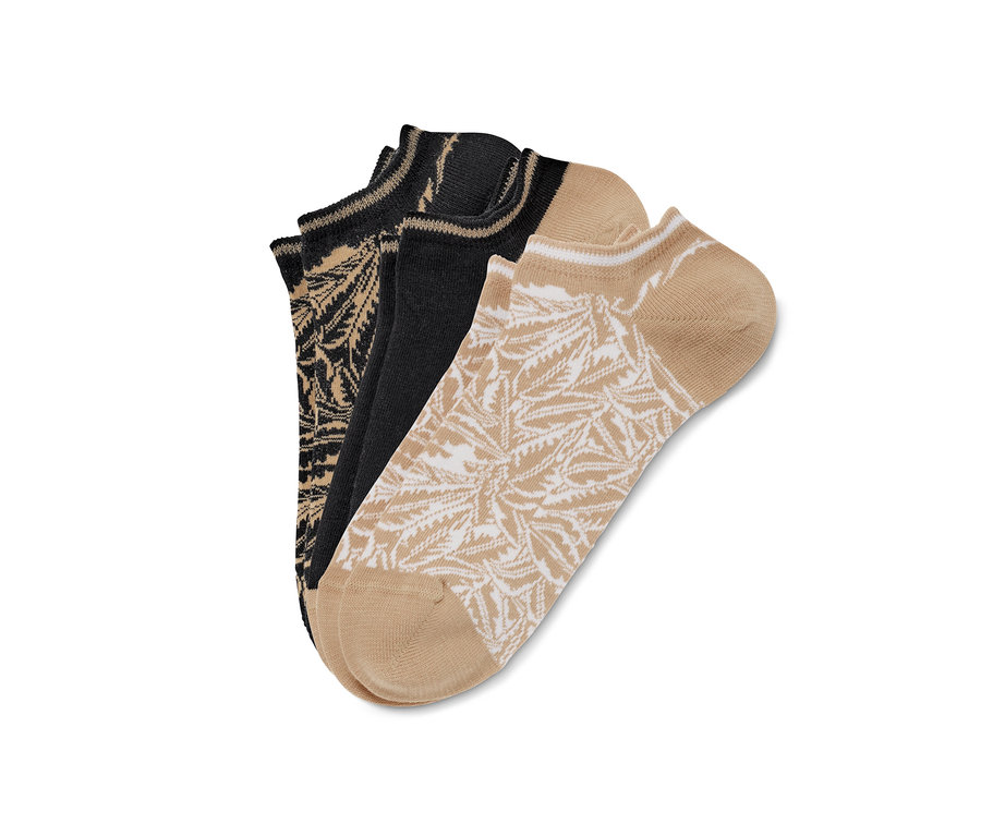 Trois paires de socquettes de sport avec motif de feuilles de palmier.