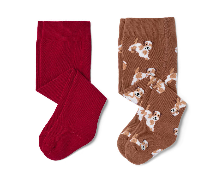 Deux paires de collants pour bébés, une paire rouge et une paire marron avec un motif de chien.