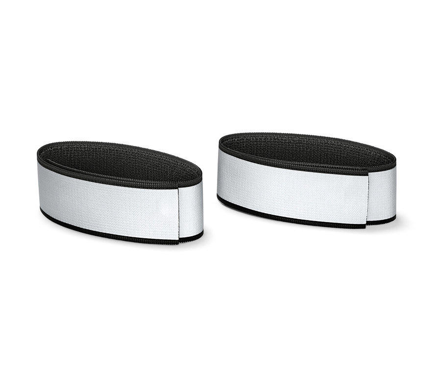 Deux bandes réfléchissantes pour pantalons sont côte à côte.