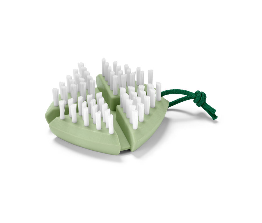 Brosse à légumes et à fruits flexible verte avec des poils blancs et une ficelle verte.