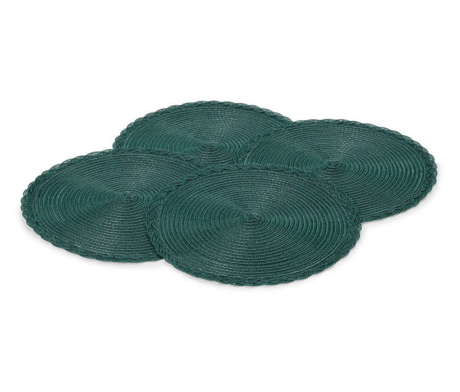 Quatre sets de table ronds et verts disposés sur un fond blanc.