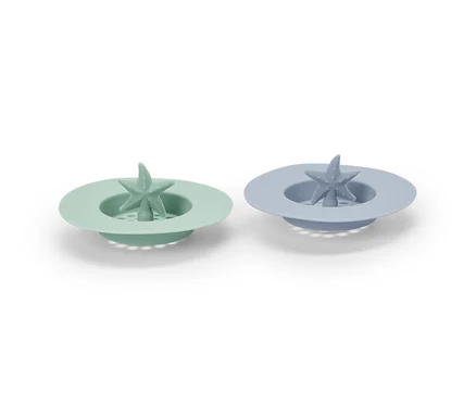Deux tamis d’évier en silicone, vert et bleu, avec motif étoile de mer.