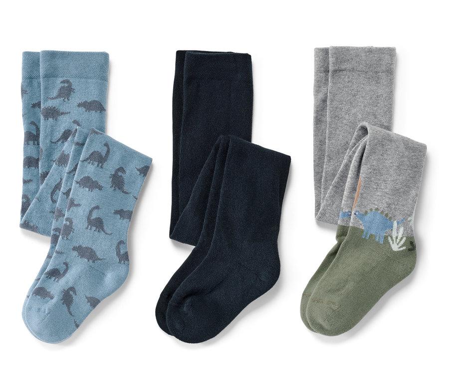 Trois paires de collants pour enfants : bleu avec des dinosaures, bleu foncé et gris avec un motif de dinosaures.