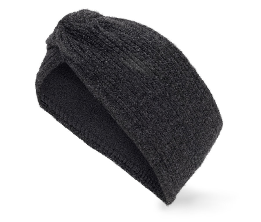 Un bandeau noir tricoté avec un nœud sur fond blanc.